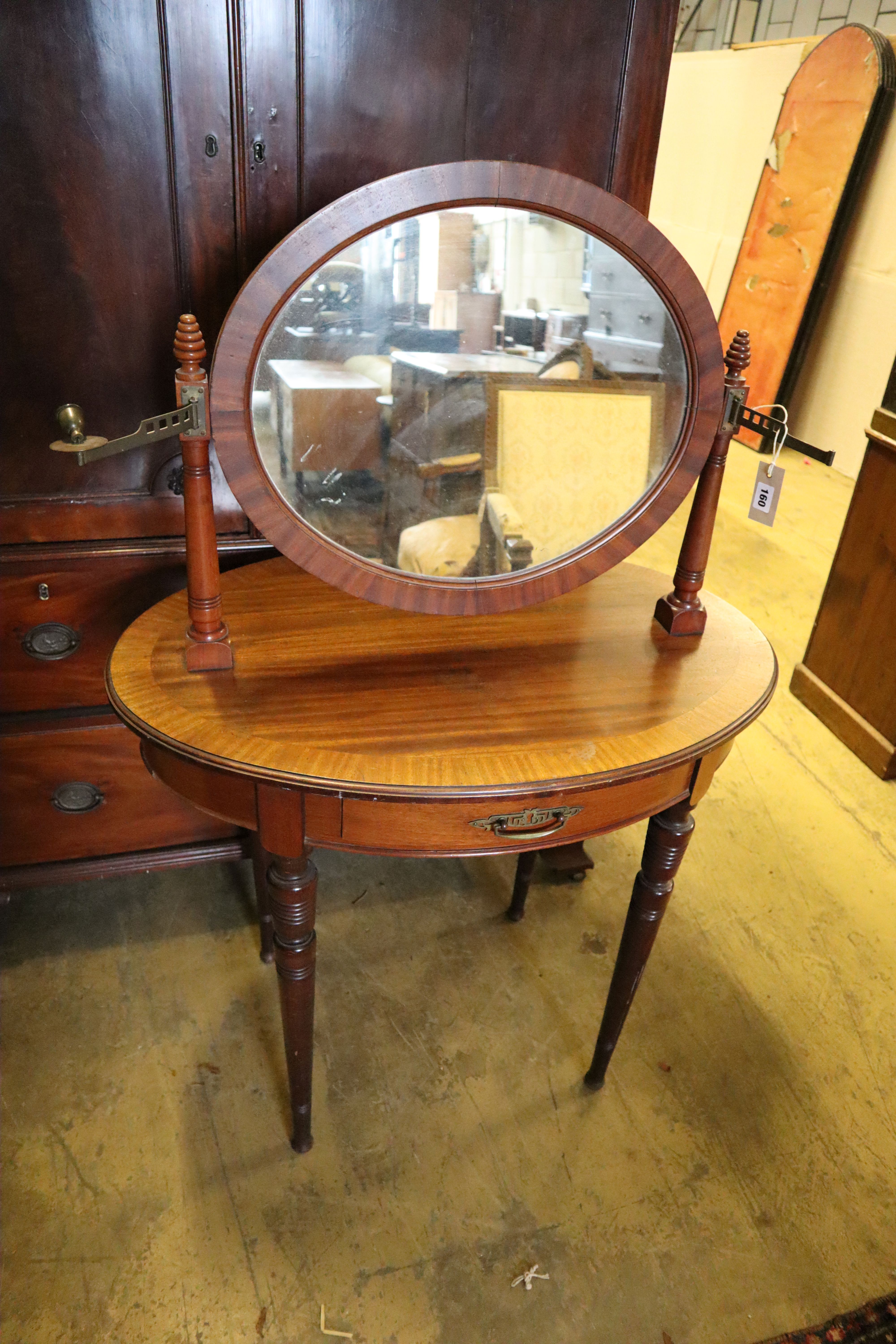 Early 20th century oval mahogany dressing table, width 85cm, depth 59cm, height 130cm